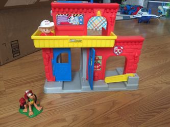 Firehouse with fire fighter and Pluto