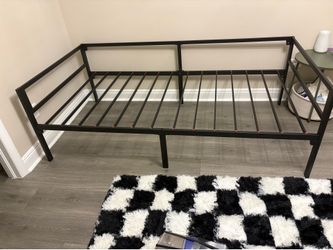 Twin Size Black Metal Platform Bed Frame  Black metal twin-size platform bed frame in excellent condition. Sturdy steel construction with multiple sup