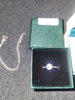 2 size 7 sterling silver rings moisinite stones amd silver bracket