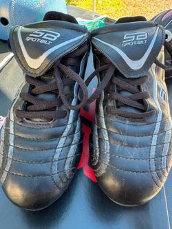 Kid’s shoe with cleats.  Black, Size 2.  Good condition.