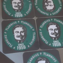 Flannigan's 7 Coaster Set. & Cup
