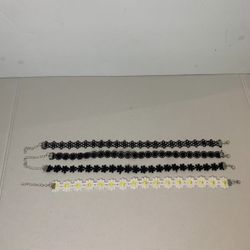 Black velvet chokers and daisy choker 4 pack.   (H)
