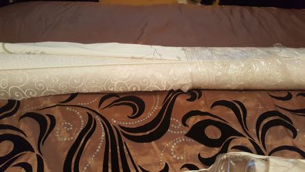 Wedding dress and runner and extra roll of table cover.