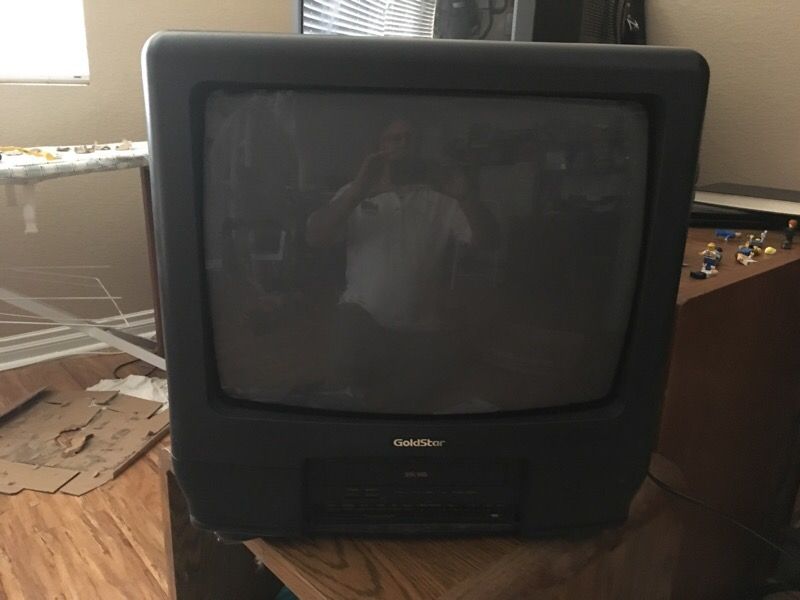 Gold star TV with VHS player built in.
