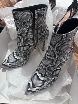MK leather snake print heeled boots