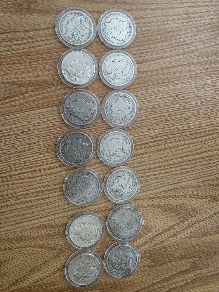 A Dozen MORGAN AND PEACE SILVER DOLLARS