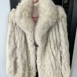 This is a Saga Fox fur coat with a pink satin lining. 