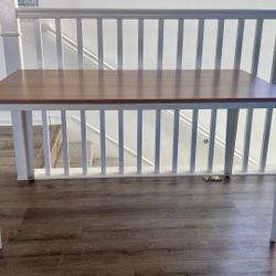 Wooden table top. Steel leg table.