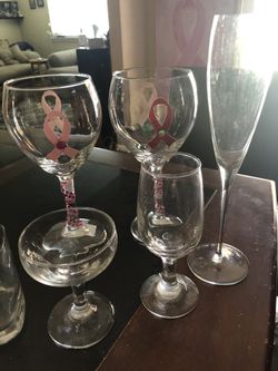 2 wine glasses with cancer symbol and candy dish n other glasses