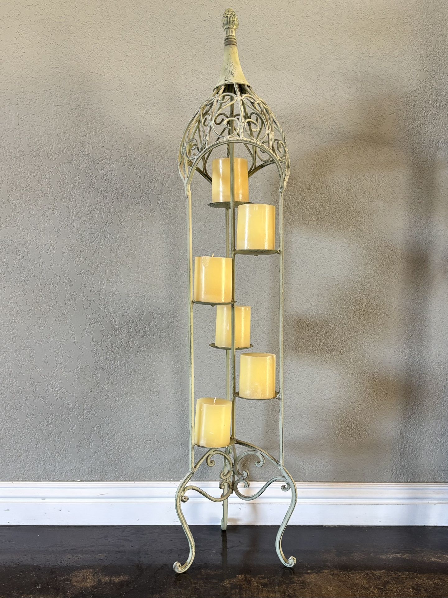 Metal candle holder with candles.