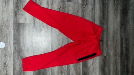 Red Nike tech sweats