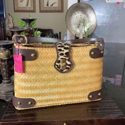 Aranaz Woven Straw Basket Handbag With Brown Leather Trim and A Leopard Print Flap Closure 
