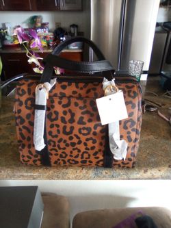 Fossil leopard purse about