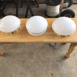 3 ceiling lamps in very good condition, two with a gold ring and one with a white r
