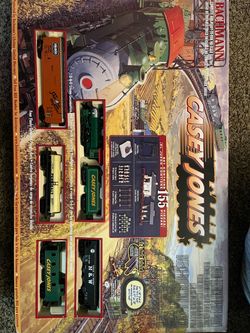 Very old train set in mint condition, open box but never operated or anything,
