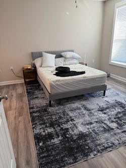 Gray Upholstered Platform Bed Frame with 1 year old Queen mattress