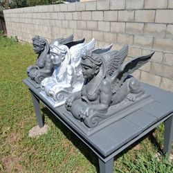 Winged lion female Sphinx statues made of fiberglass and cement coating 3 in total.$35 Each 