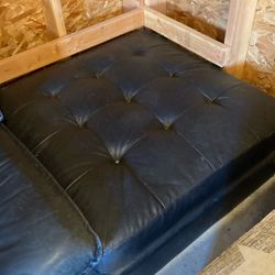 Black ottoman, leather