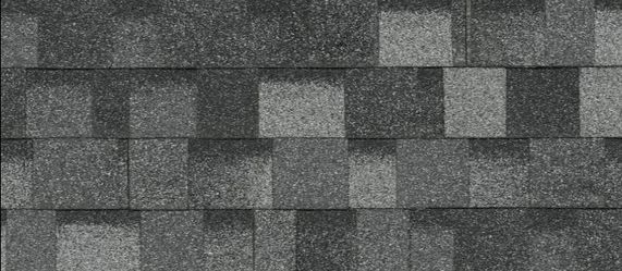 Truck loads roofing shingles