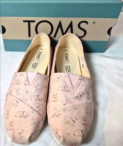TOMS Alpargata Pink Year of the Pig Women's Size 8New TOMS Alpargata slip-on shoes in women's size 8 W. These canvas shoes feature a light pink color 