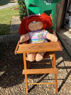 Vitage toy doll high chair with a doll