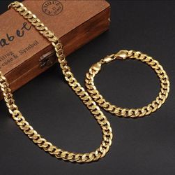 New 18 k yellow gold Cuban link chain and bracelet