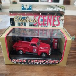  Ford F-100 red pickup. Comes with a die-cast collector gas pump