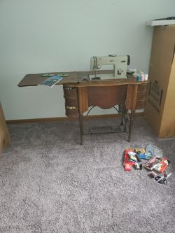 Pfaff And The 1(contact info removed) Free No. 5 Treadle Sewing Machine in Oak Cabinet.