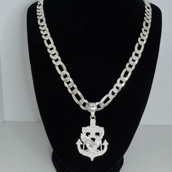 Cadena fígaro con dije de águila, en cruz de ancla plata  925