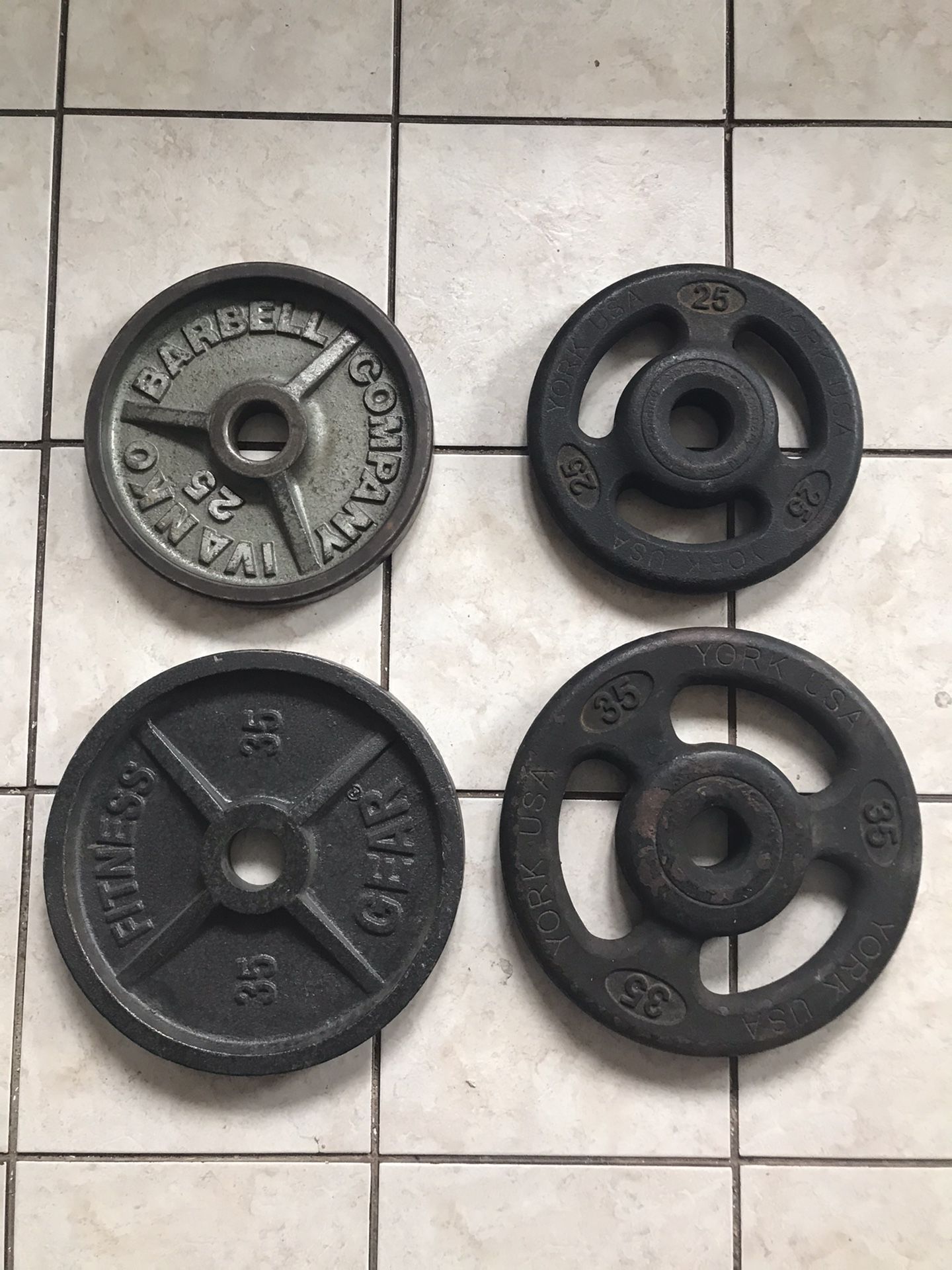 2 x 25 and 2 X 35 lb. Olympic Plates