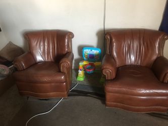 Two couch chairs spin around 360 and rock