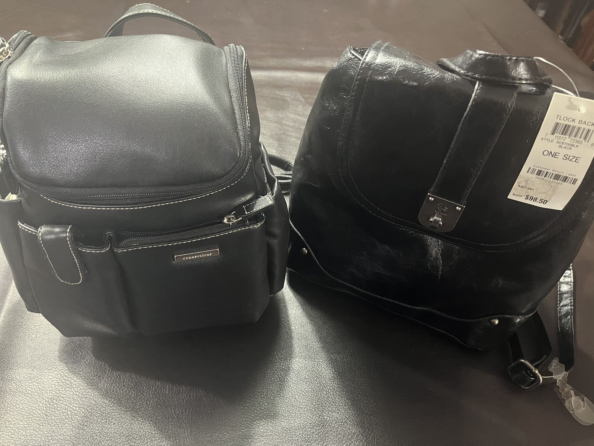 Two black backpack purses. Never Used one with tags.