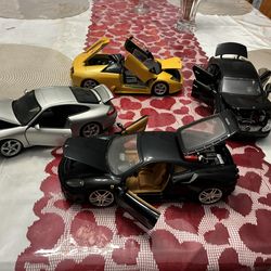 Four Die Cast Metal Cars