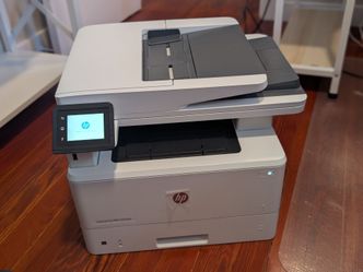 Like-new HP printer - 4-in-1: high-speed printing, scanning, copying, and faxing.