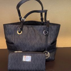 Michael Kors Jet Set Medium Logo Pocket Tote Bag in signature-print canvas with gold-tone hardware. 