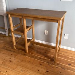 Wooden Table With Two White Cushion Stools 