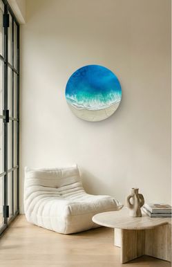 Round seascape painting with white sand beach and splashing waves