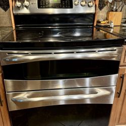 30-inch freestanding electric double-oven range with a stainless steel finish and smoot