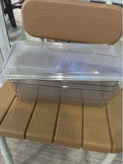 3 storage boxes with lids.