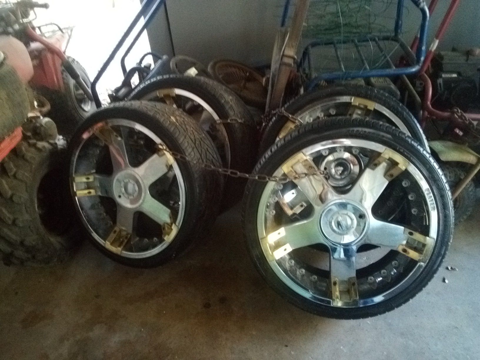 Photo I have a pair of 22 inch rims and tires and I have a pair of 26 inch rims and tires for sale