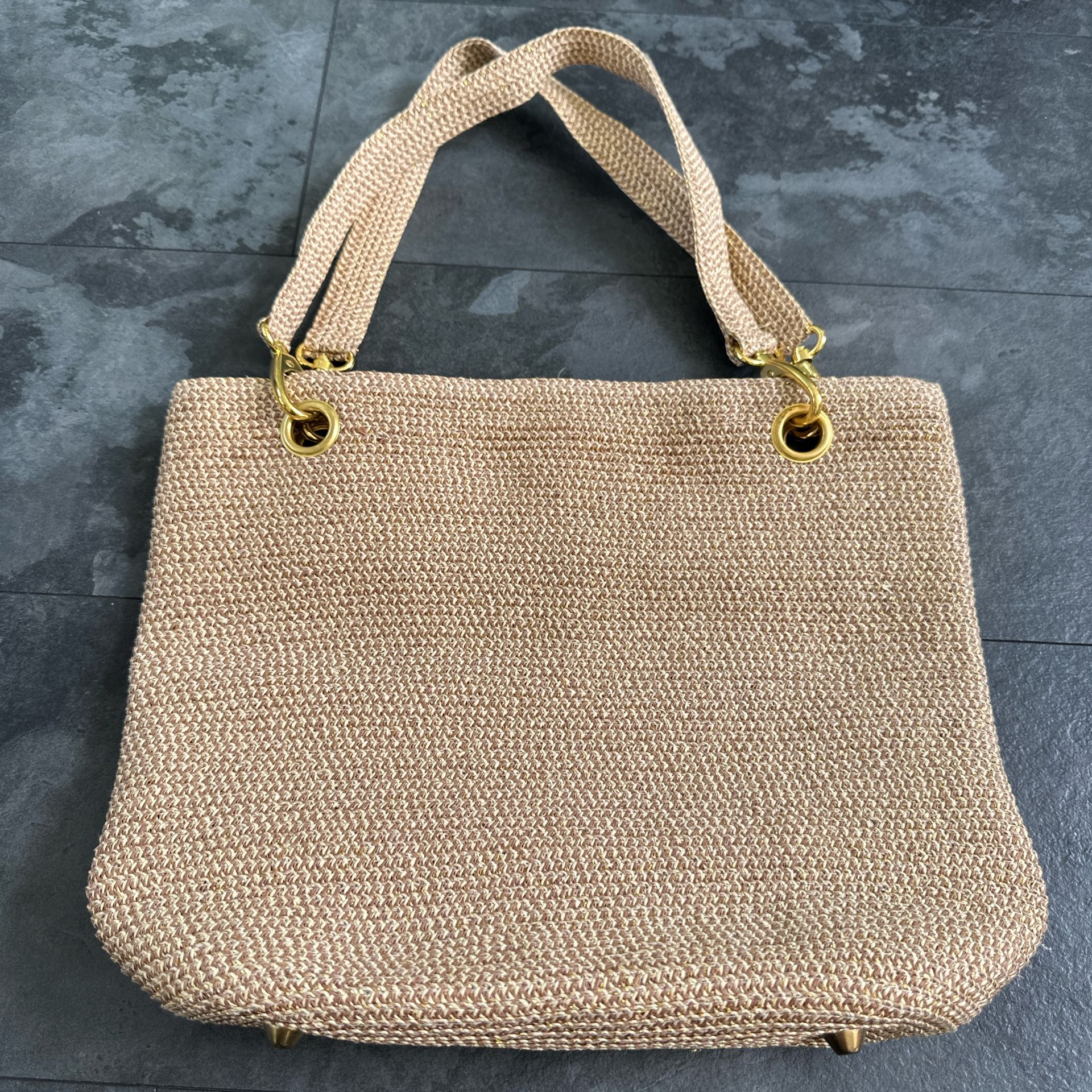 Cream and tan straw tote bag with gold hardware magnetic snap closure 