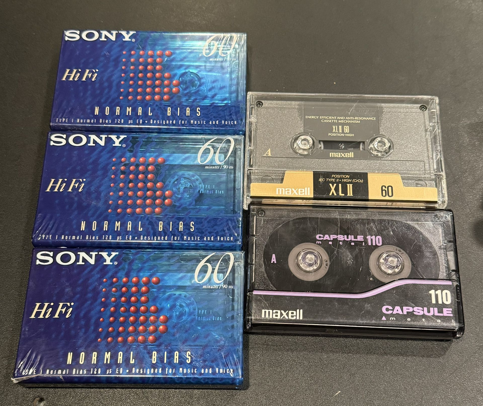 Vintage Cassette tape lot 5 pcs. Includes Maxell Capsule metal 110 Minute, 3 Sony Type 1 60 Minute , & Maxell High Bias XLII 60 Minute. The 3 Sony cas