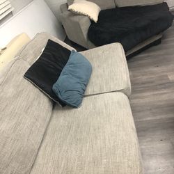 a two-seater (loveseat) with extended seat (chaise)