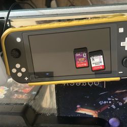 A Switch Lite That Comes With Game And A Switch Oled That Comes With Games Too