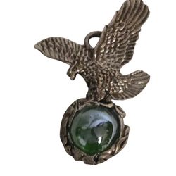 eagle cast iron pendant clasping green glass orb