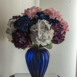 Blue Glass and Black Iron Vase with Flowers