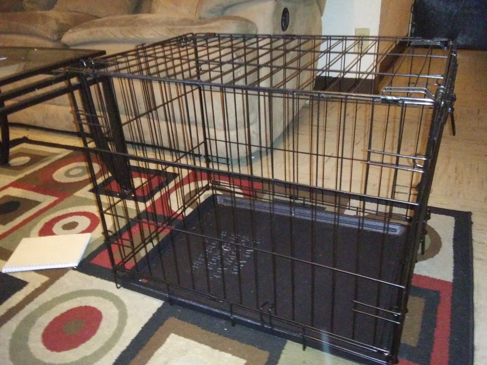 Med. Size fold up Dog Cage like new asking 20$ firm 2 foot long 1/ 1/2 in height