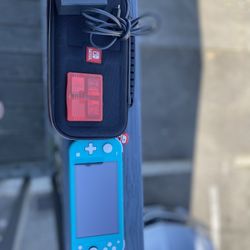 Nintendo Switch Lite – Great Condition + 3 Games & Case