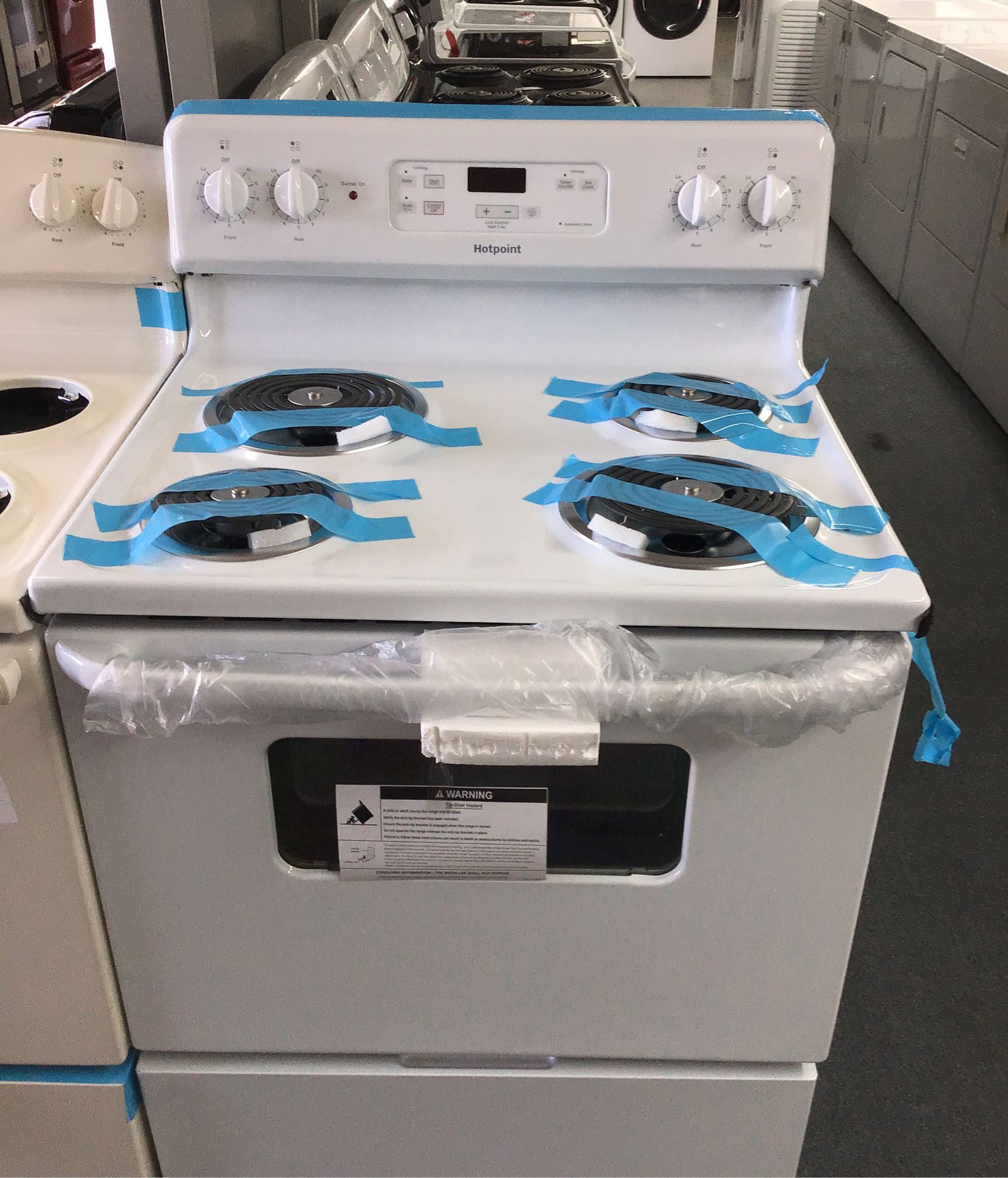 New scratch and dent Hotpoint coil top range. 1 year warranty
