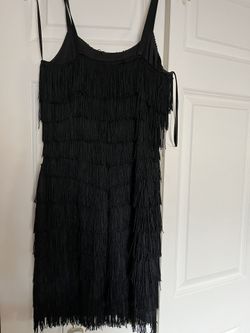 It’s Very Cute Short Cocktail Dress The Size Is Six. The Color Is Black. It’s All Tassel.Dress 